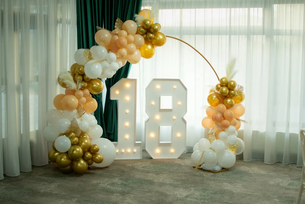 Illuminated marquee number with balloon decoration