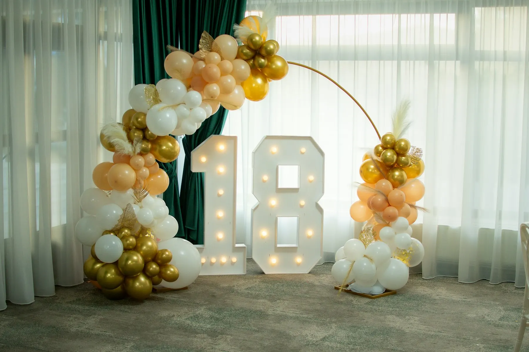 Illuminated marquee number with balloon decoration