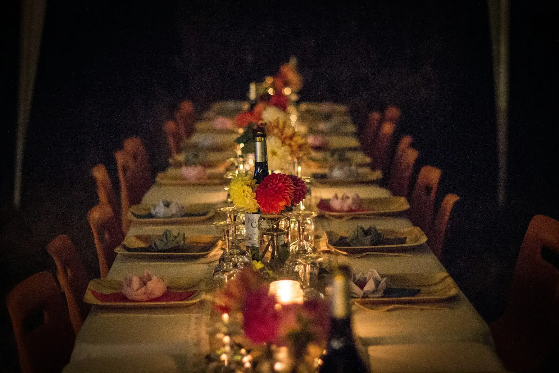 Dinner table dressed with flowers and candles