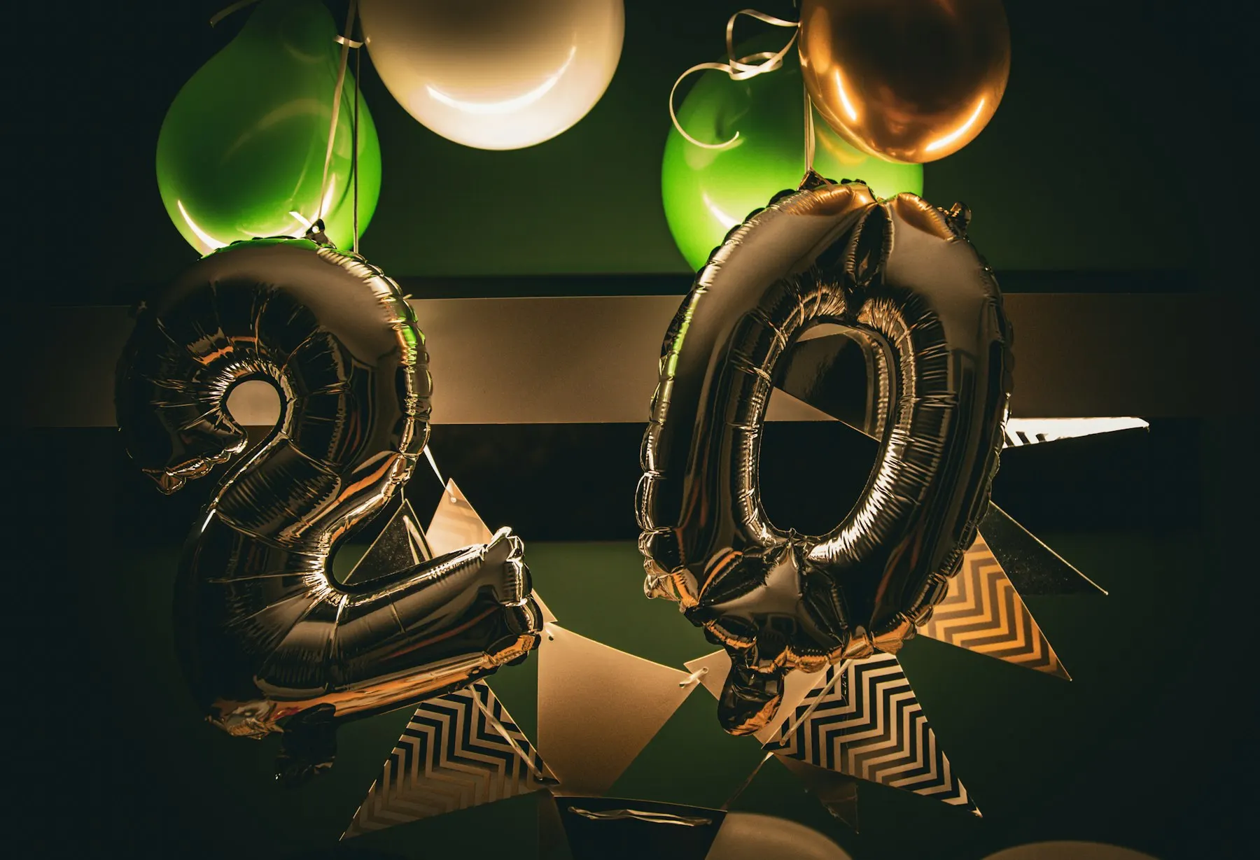 Metallic number balloons with gold and white garland