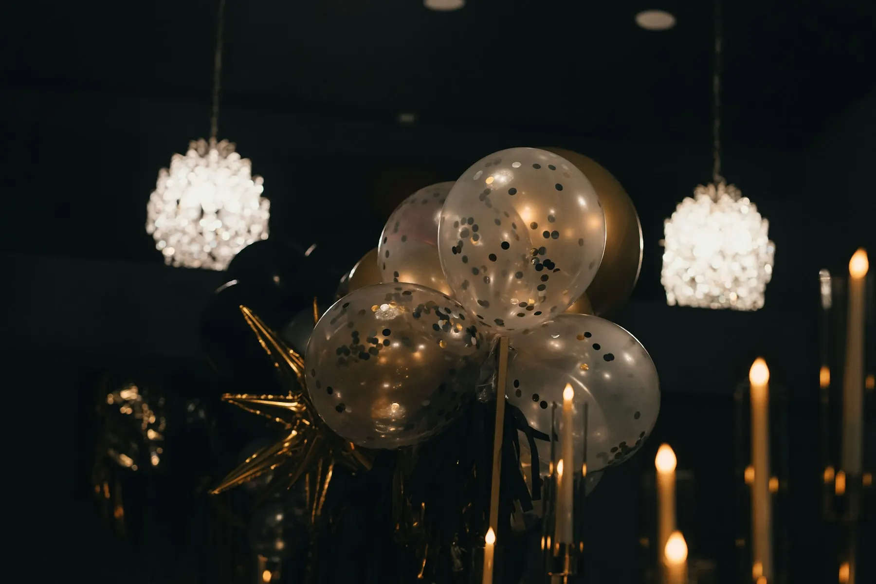 Balloons and festive lights in a dark room
